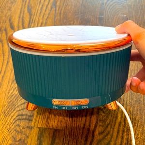 Green humidifier for essential oils with changing light inside